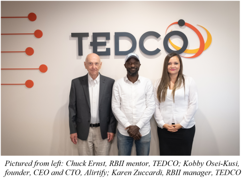 Three people standing in front of TEDCO Sign. Chuck Ernst, Kobby Osei-Kusi, Karen Zuccardi. 