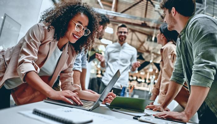 people in office working together smiling