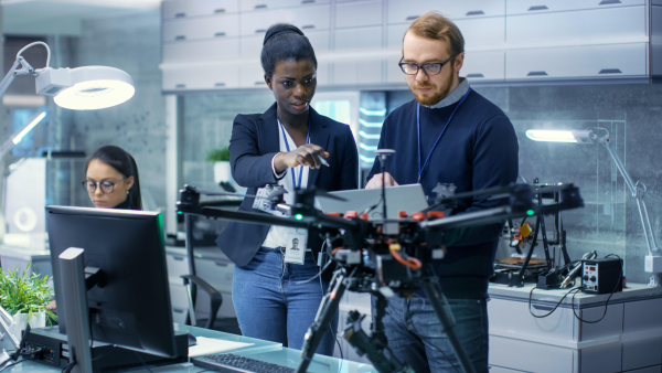 Entrepreneurs work on a drone in a Makerspace