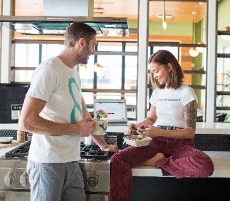 Ariane Valle, co-founder and chief experience officer and Turner Hoff, co-founder and CEO of Vegetable + Butcher talking over food and beverages