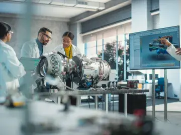 Four individuals working on aerospace technology