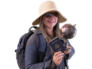 Karen Zuccardi in sunhat and sunglasses holding passport and small globe, backpack on