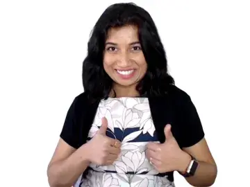 Avanti Shetye, CFA in black cardigan gives two thumbs up on white background.