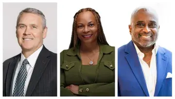 Three smiling business professionals in portraits, side by side on a white background