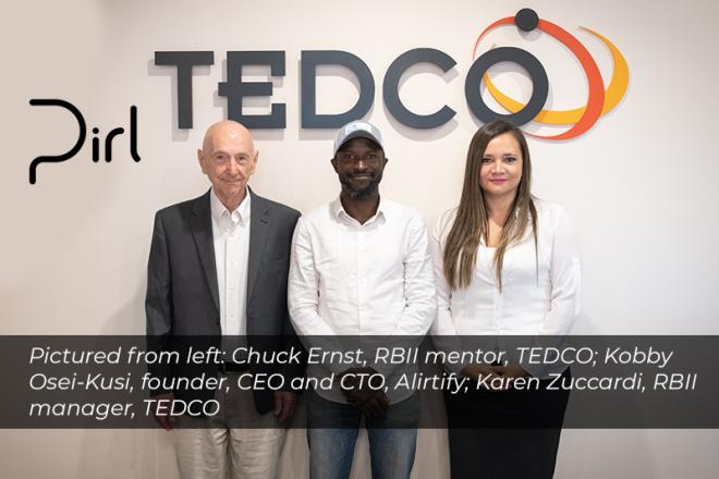 Three People Standing In Front of TEDCO Sign. Chuck Ernst, Kobby Osei-Kusi, and Karen Zuccardi